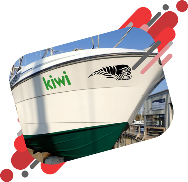 Kiwi logo boat decal applied to the side of a big white boat