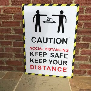 social distancing signs give reminder of covid restrictions