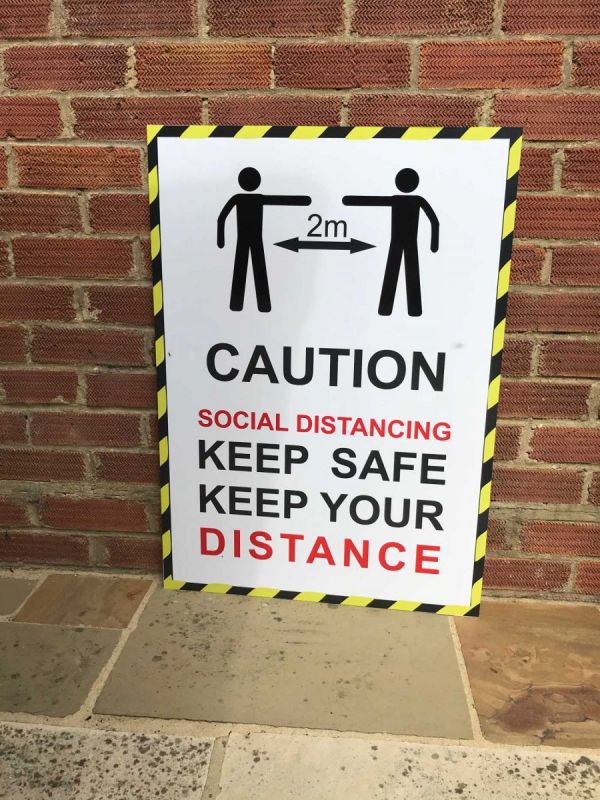 social distancing signs give reminder of covid restrictions